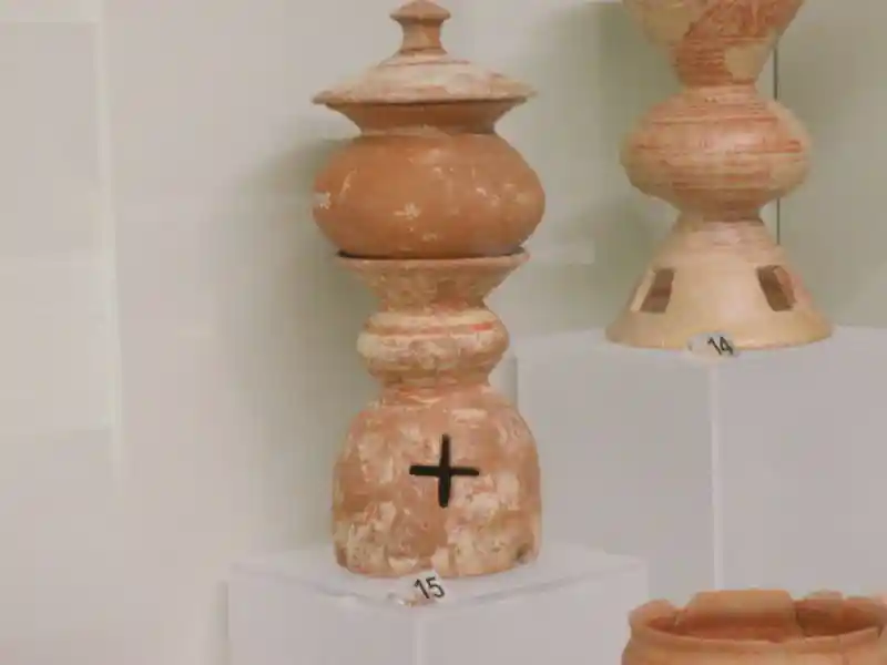 Pre-Christian cross carved on clay pot, tomb, type of burial